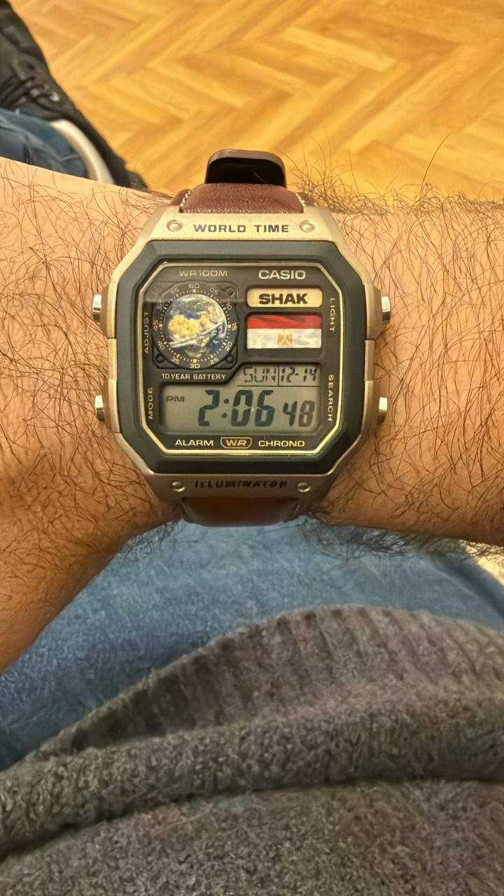 A cutomer wearing his new custom casio royale (AE-1200) watch, with a globe + Egyption Flag + His Initials in the watch