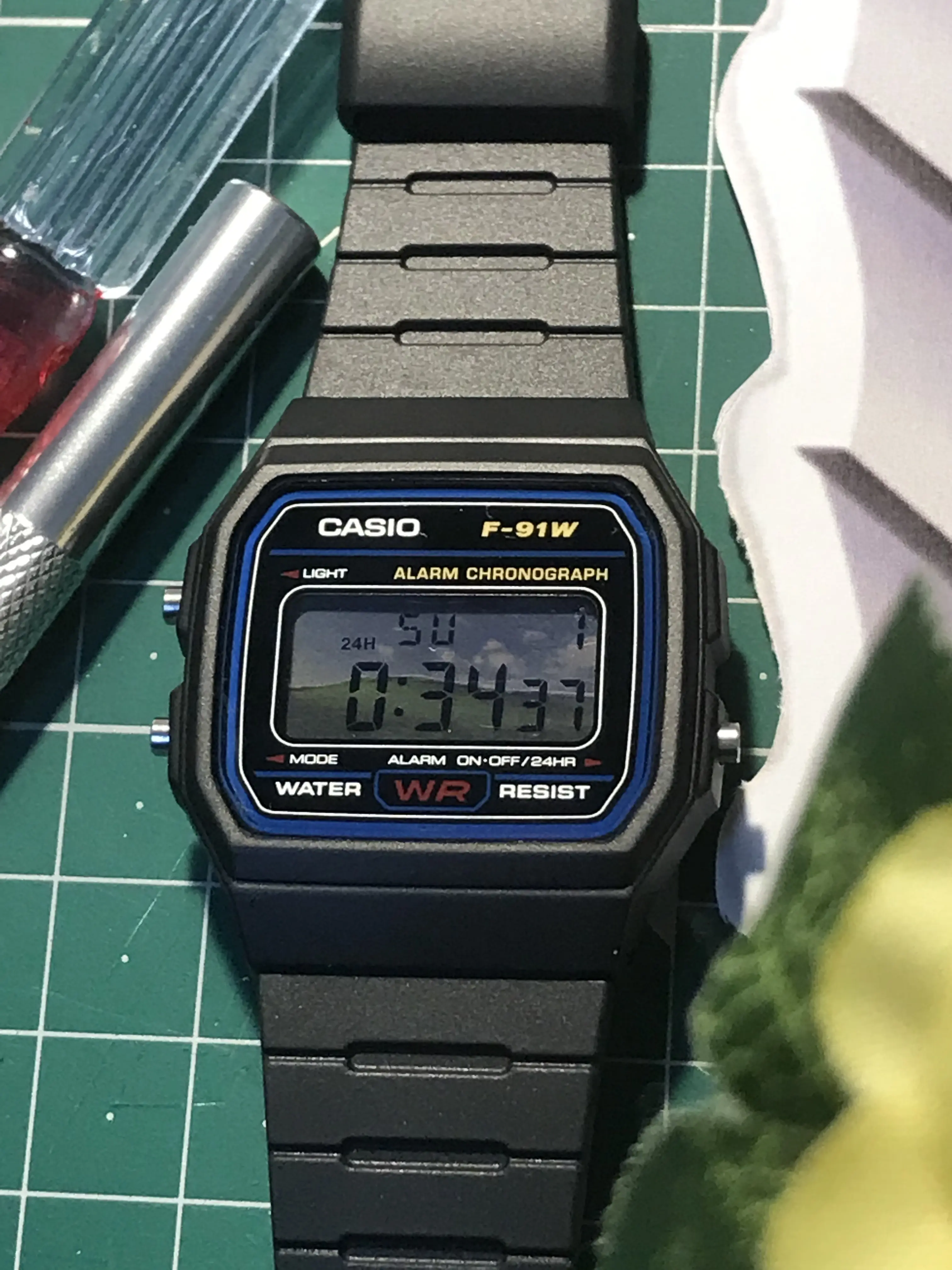 Custom Casio F91W - Windows XP Desktop theme - Bliss - Close up - Multi-Layer Parallax Display -  on the green mat with the workshop tools