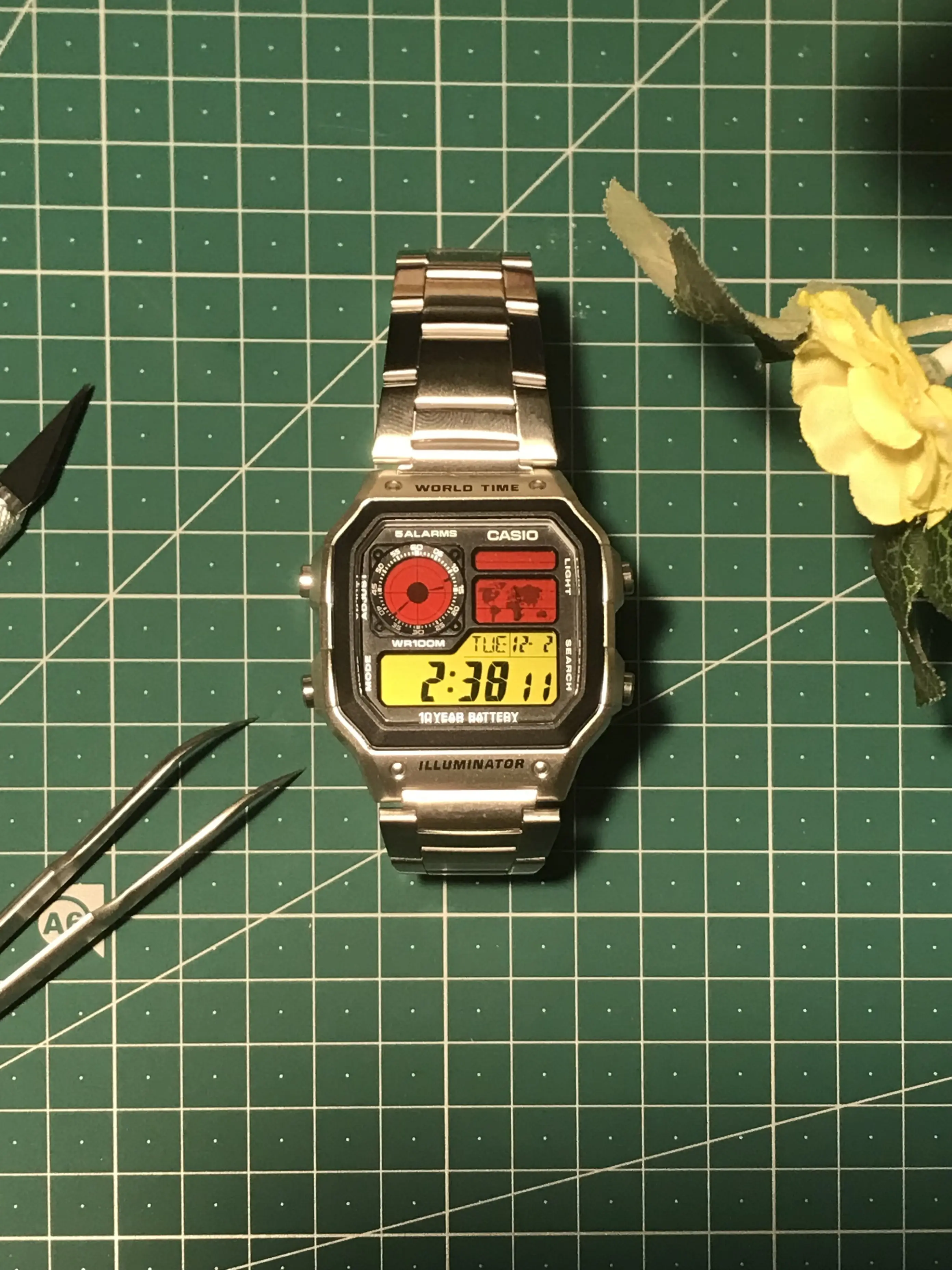 Workshop flatlay Casio AE-1200 (Royale) filters cutting mat tools the Casio Watch